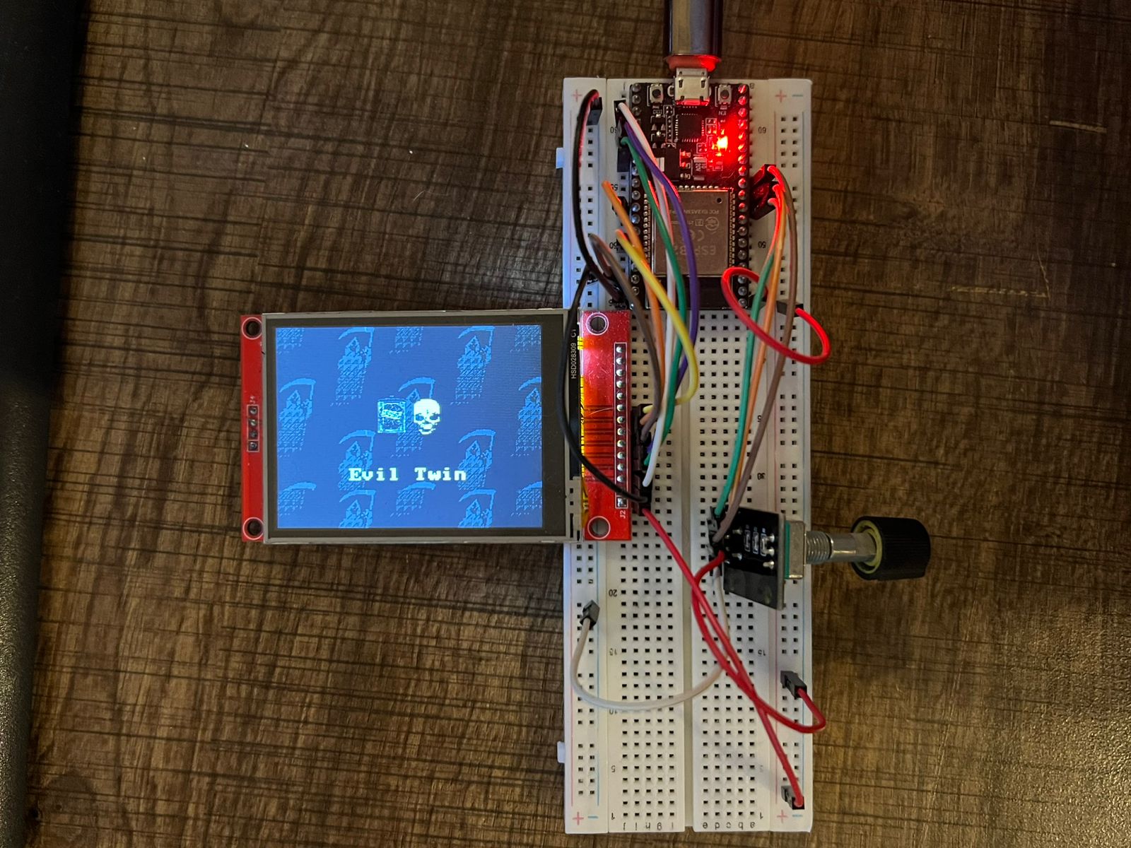Phantom prototype on a breadboard — small screen, twist knob, and microcontroller